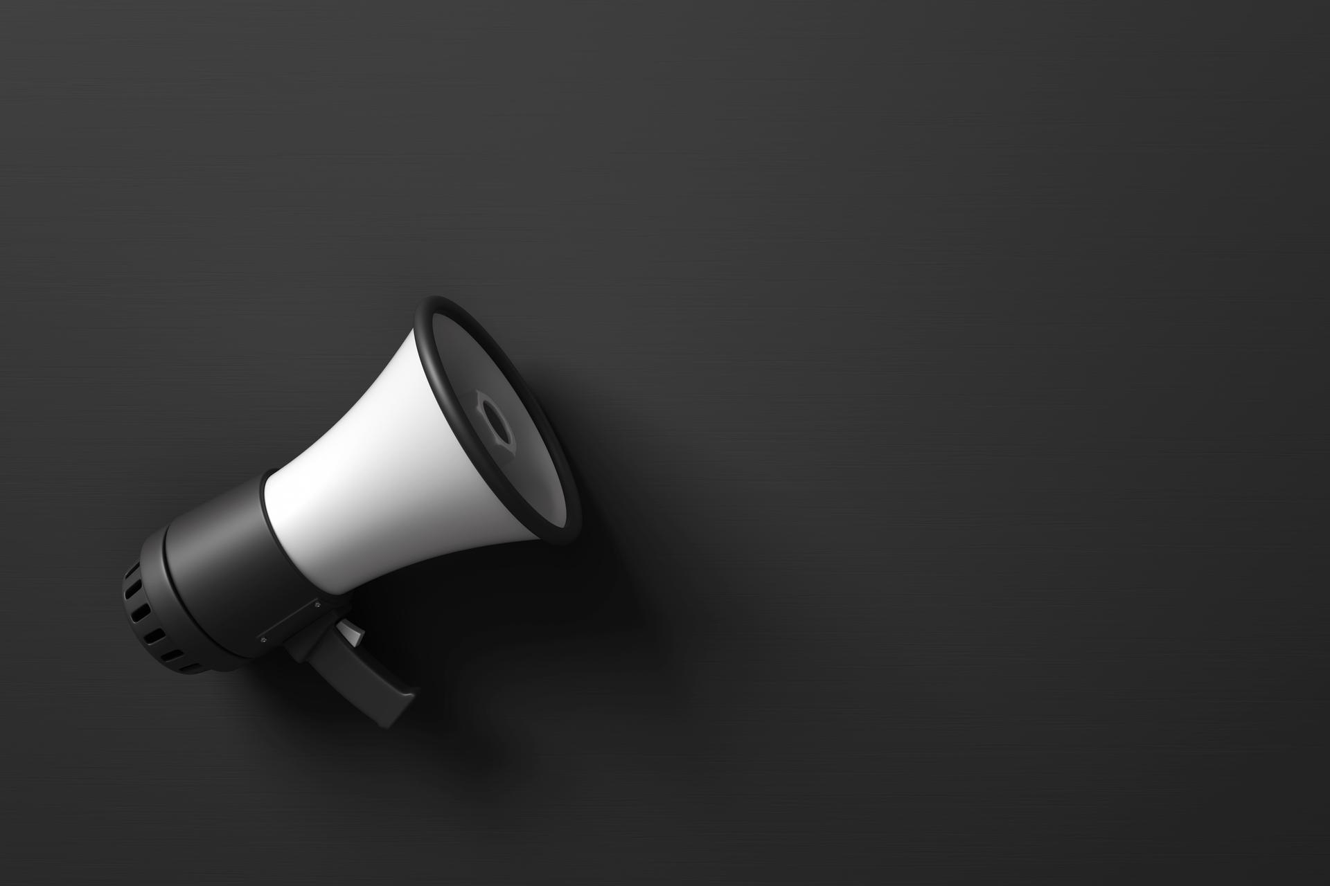 Black Electric Megaphone on Dark Background Stock Photo